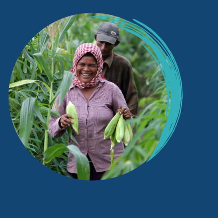 farmers walking across a green field