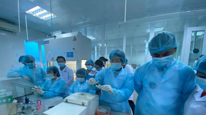 Technicians at central and provincial labs in Vietnam process COVID-19 tests. Photo credit: NIHE.