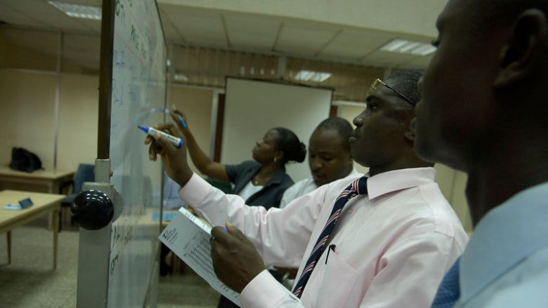 Business people at work in Ghana