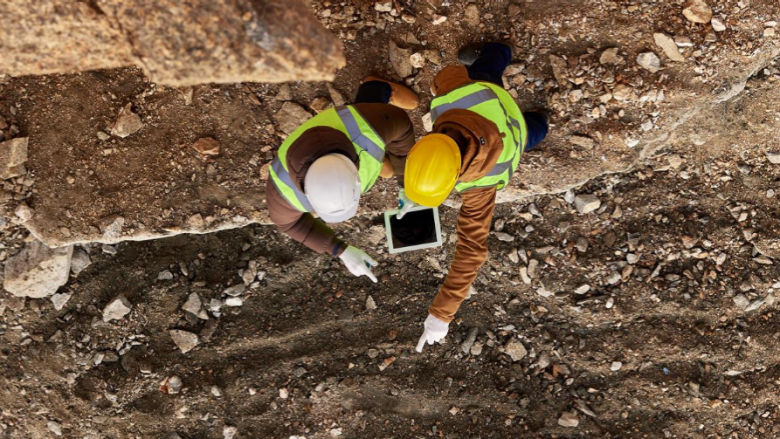 Miners discussing the landscape