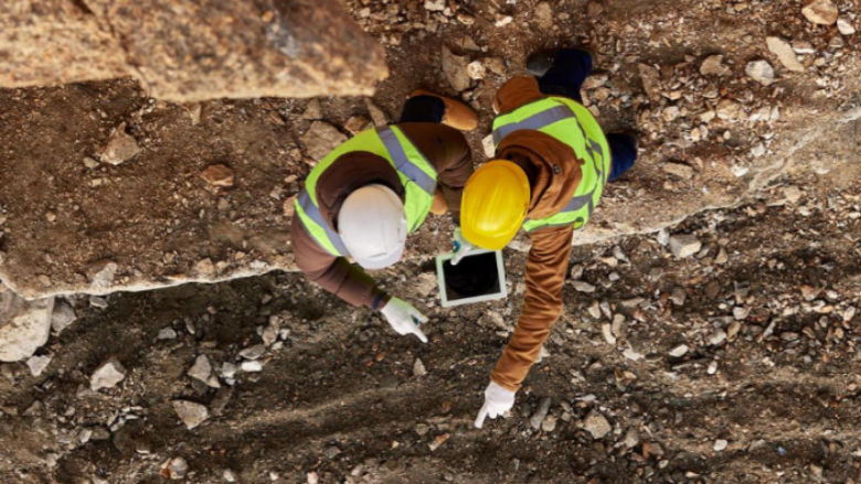 Miners discussing the landscape