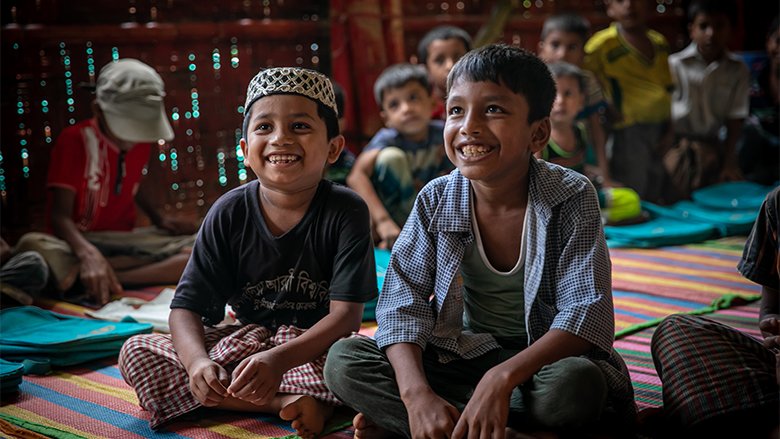 Young Rohingya children receiving education.