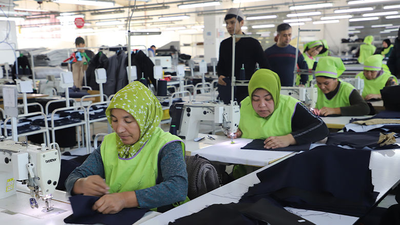 Rows of Uzbek factory workers at a cotton manufacturing and processing plant.