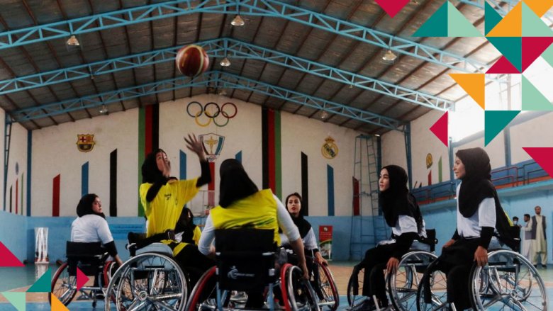 Young women in wheelchairs playing ball. Photo credit: © Mohsen Karimi / Getty Images