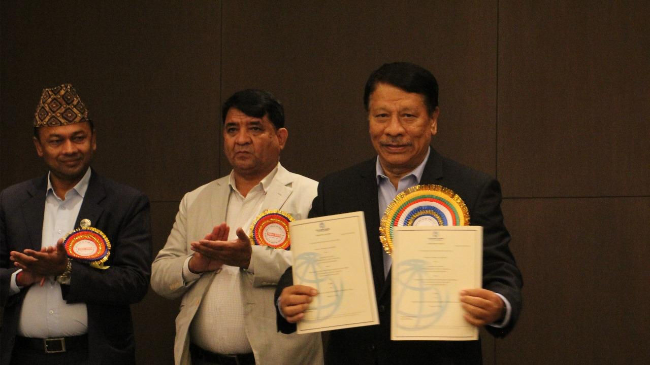 Deputy Prime Minister Prakash Man Singh holds the PLRIP Appraisal Document 