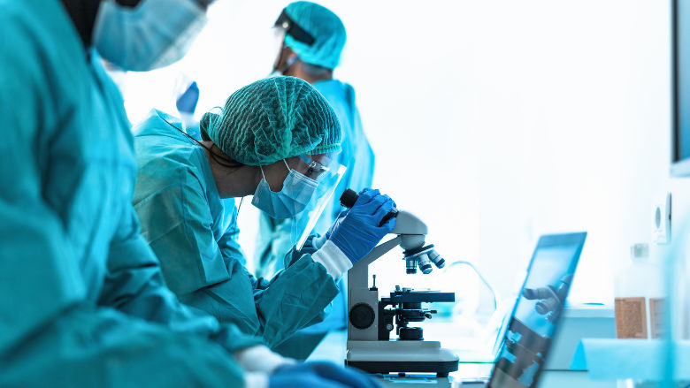 Medical workers doing analysis in laboratory during corona virus outbreak.