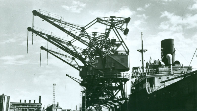 Black-and-white photo of electric gantry cranes installed in France with World Bank financing