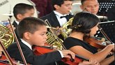 children in Honduras playing in orchestra