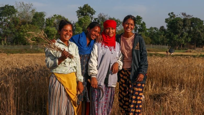 Girls from Nepal are seen in the field 
