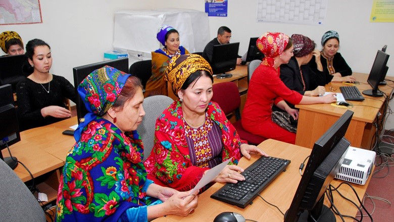 women working on personal computers
