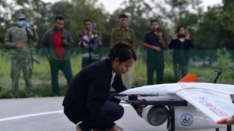 Meghalaya Girl-Putting-Medicines-Onto-The-Drone.jpg