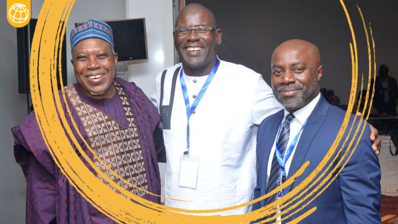 Three smiling people at a workshop