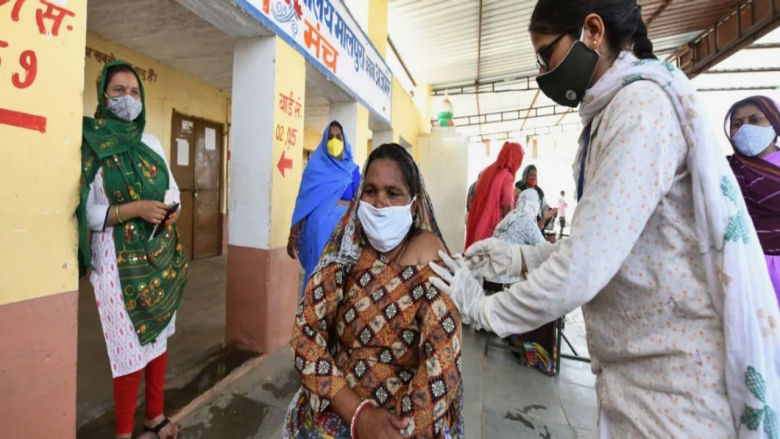 Woman in India being vaccinated PHC