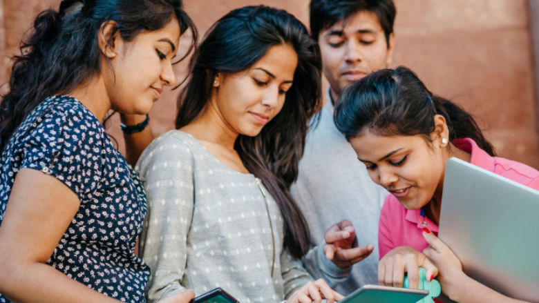 Indian youth with digital devices