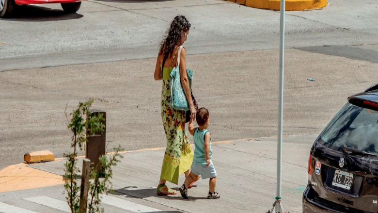 Woman with kid walking