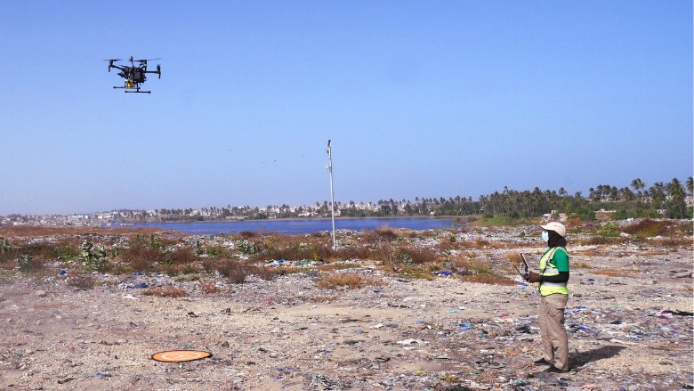 A technician uses a drone to measure methane emissions from a landfill in Senegal. Image by Leonardo Viotti.
