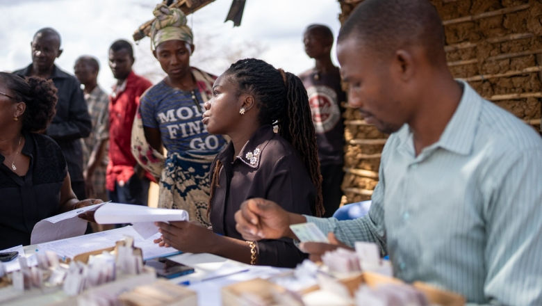 People at registration desk issuing IDs in Mozambique