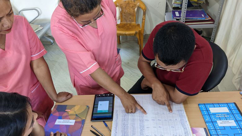 Nagaland-NHP-DPMU-checking-documentation-in-a-sub-centre.jpg