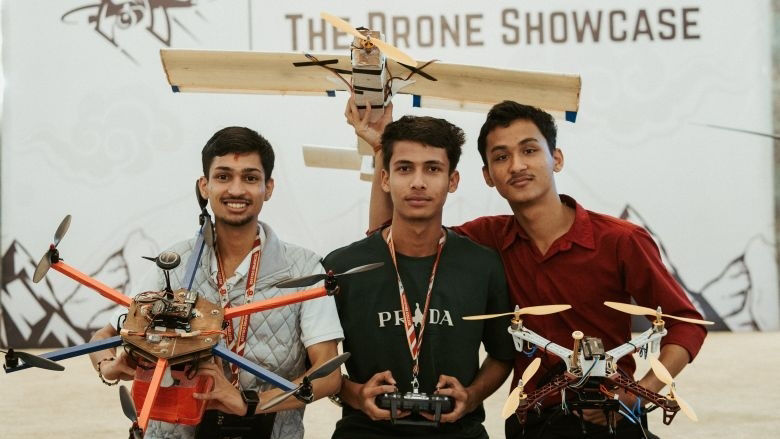Youth holding drones in a drone showcase event in Nepal