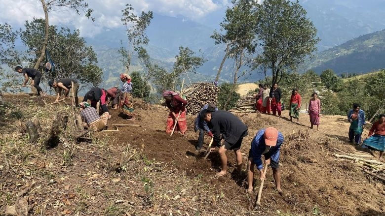 People clearing land during construction of a park in Nuwakot, Nepal