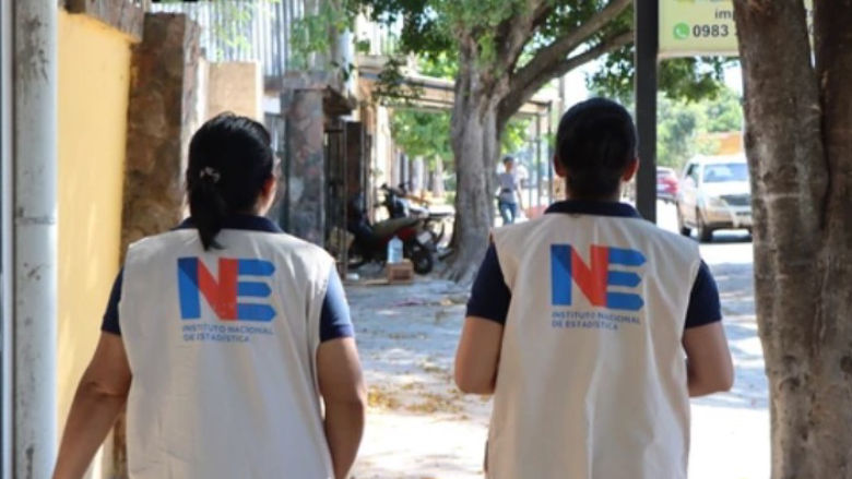 PARAGUAY-Two women with INE vests walking in the streets