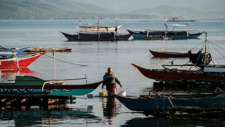 Local fisherfolk return to shore early morning to be able to sell their catch to fish vendors in Puerto Princesa, Palawan