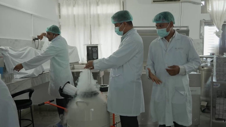 Veterinary technician using ultrasound machine to detect pregnancy at Dhanpal Veterinary Service in Morang.