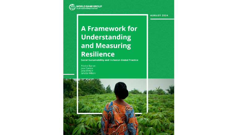 Woman standing in a lush field.