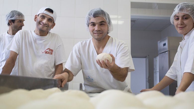 Employees at a bakery in Romania that employs persons with disabilities