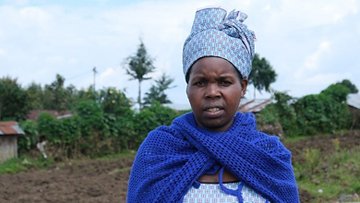 Rwanda-woman in blue dress Mukesimana-Chantal