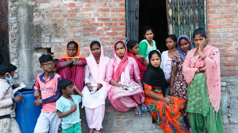 Indian rural women sitting in a community meeting.