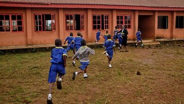 Pupils enter school buildings in Edo State, Nigeria