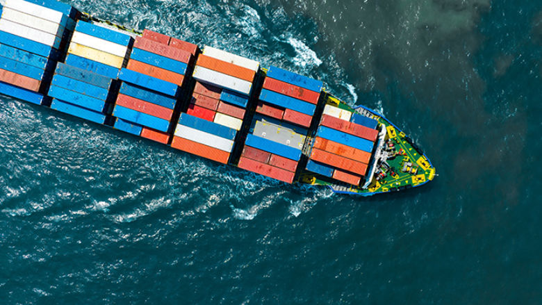 Cargo ship over water.