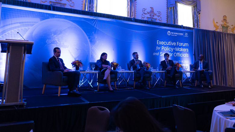 four panelists on stage speaking