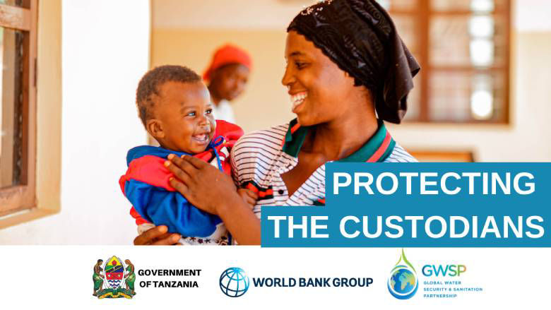 A mother holds her child in a healthcare facility in rural Tanzania.
