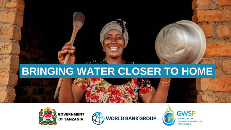 Woman in rural Tanzania with a steel bowl for water.