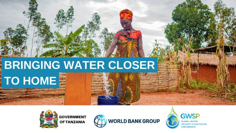 A woman in rural Tanzania pours water from a community spout.