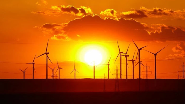 photo of windmills in Romania during the sunset