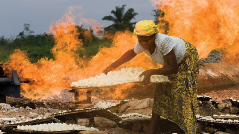 Woman by gas flare