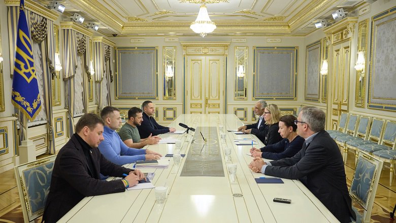 A World Bank delegation sits at a table with a Ukrainian delegation led by President Volodymyr Zelenskyy