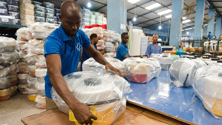 Factory workers package products at Decorplast, a manufacturer and regional exporter of injection-moulded plastic goods in Accra, Ghana