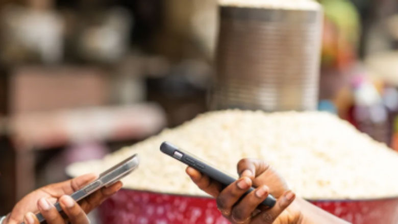 2 hands making digital payments with phone