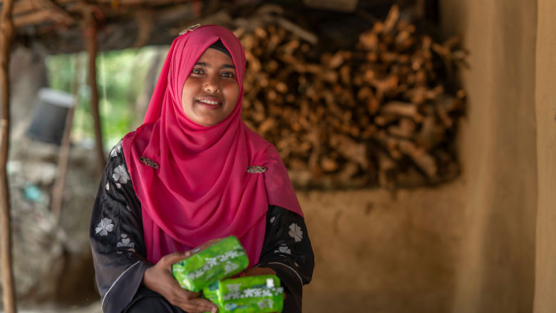 Young Bengali girl holding sanitary pads