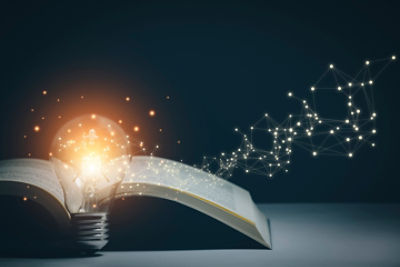 A light bulb with a book