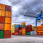 Cargo containers with blue crane