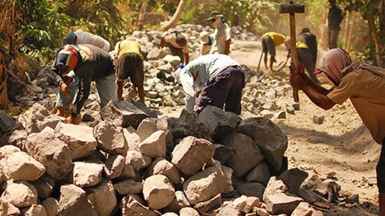 Rebuilding a road after an eruption of Mount Merapi, Indonesia.