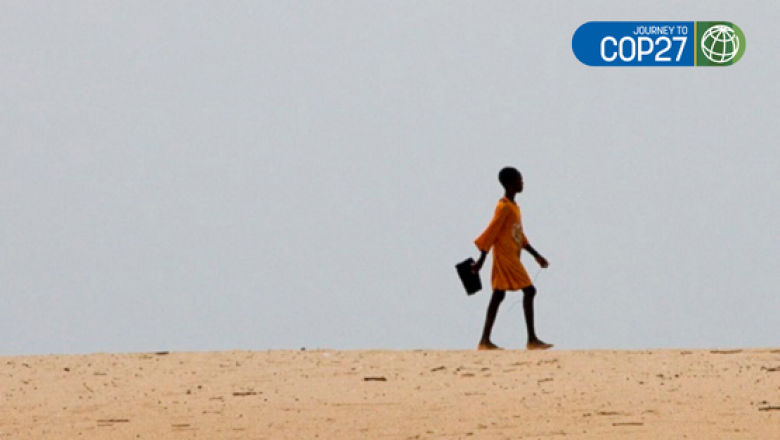 Girl walking to school in an arid landscape in Ghana. Photo: Arne Hoel/The World Bank