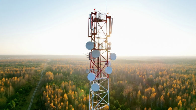 A 5G tower towering over a field