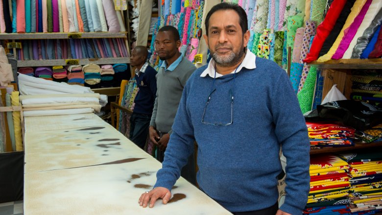 Man selling textiles