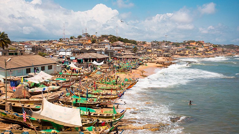 View of beachfront and boats in Accra